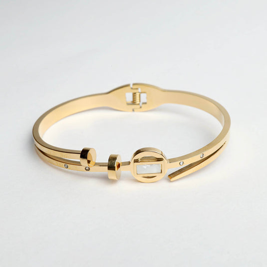 QuinShine gold sleek arch bracelet with modern geometric design and small embedded stones