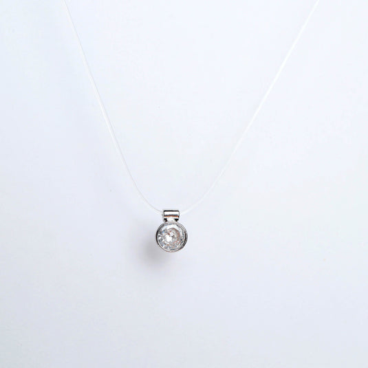 QuinShine gold transparent chain necklace with a clear round pendant on a white background