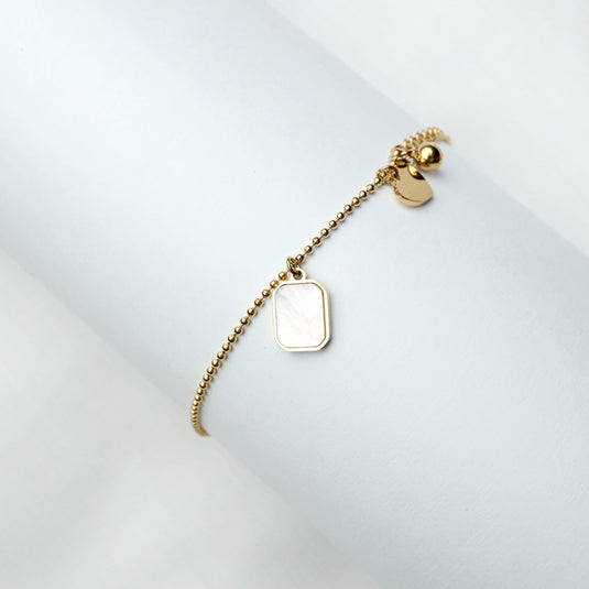 QuinShine golden keepsake bracelet with charm and minimalist design for elegant styling