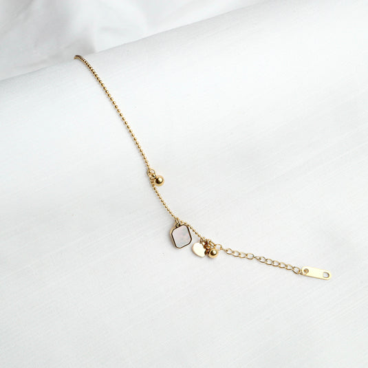 QuinShine golden keepsake bracelet with decorative charms and adjustable chain for elegant styling