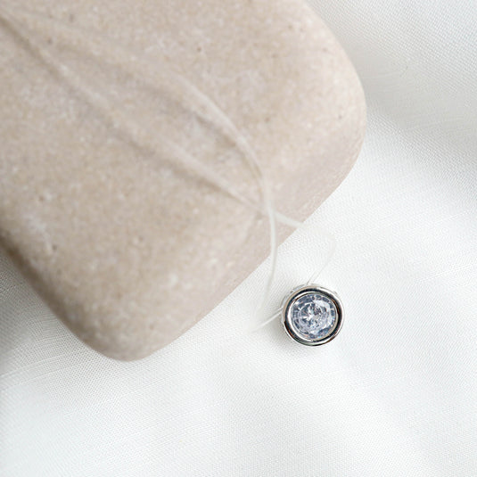 QuinShine halo bezel necklace with clear round gemstone pendant on transparent string