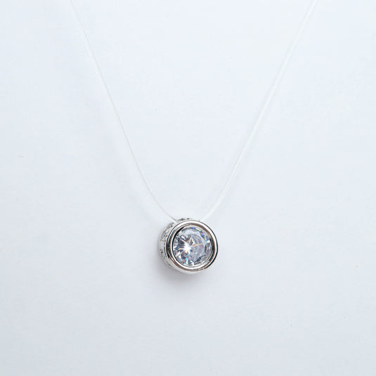 QuinShine halo bezel necklace with round clear gemstone set in silver pendant on transparent chain
