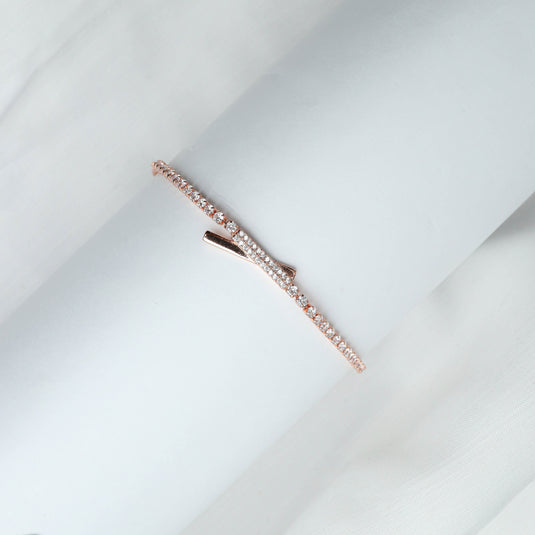 Rose gold delicate bracelet with intersect design jewelry style and embedded sparkling stones