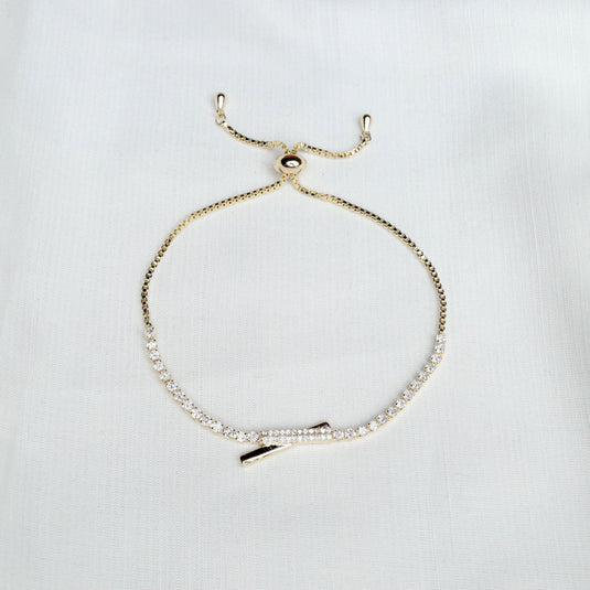 Elegant Intersect Sparkle Gold Bracelet with adjustable chain and crystal embellishments