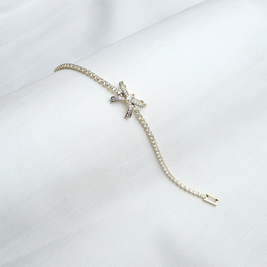 Elegant diamond accent bow bracelet with sparkling crystals on a delicate gold chain