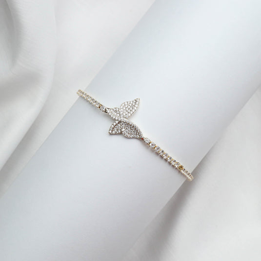QuinShine lightweight designer Angel Wing bracelet with sparkling stones on a white display