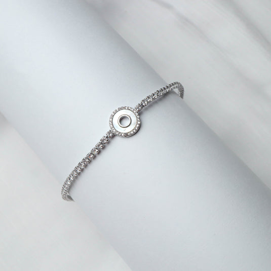 QuinShine Lunar Glow tennis bracelet with sparkling stones and elegant circular centerpiece