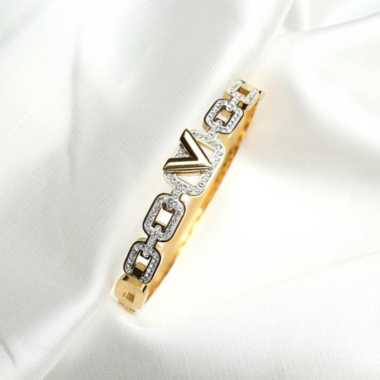 QuinShine luxury brilliance bracelet featuring gold and diamond-studded geometric links on white fabric