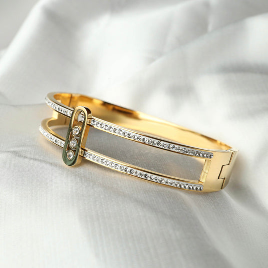 QuinShine luxury gleam bracelet in gold with sparkling crystals on white fabric background