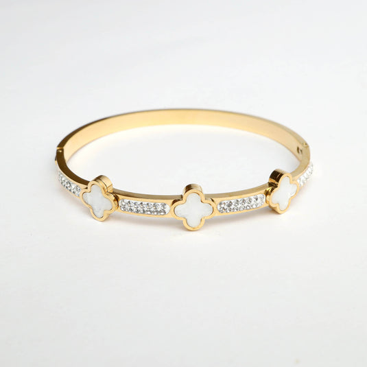 QuinShine luxury gold bracelet featuring decorative white accents and sparkling stones