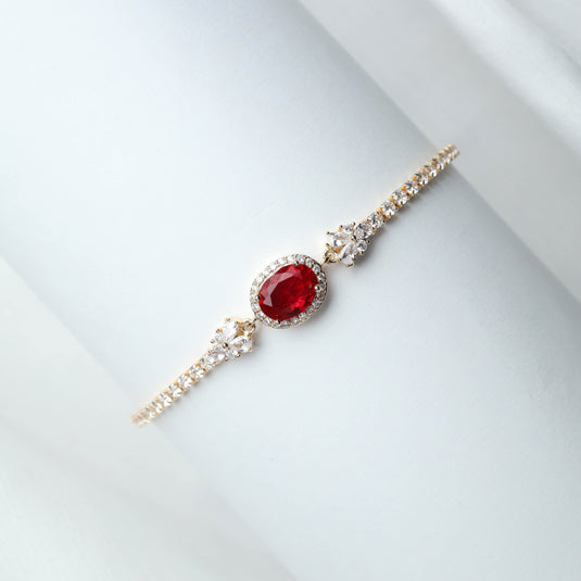 QuinShine elegant ruby gemstone bracelet with a central red ruby and sparkling clear stones on gold band
