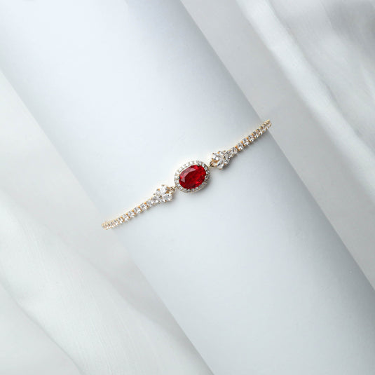 QuinShine elegant ruby gemstone bracelet with a central red oval stone and sparkling side accents
