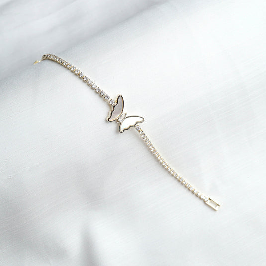 Luxury tennis bracelet with butterfly design featuring a delicate butterfly centerpiece on a sparkling stone chain