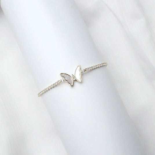 QuinShine luxury tennis bracelet with butterfly design featuring delicate stones on white background