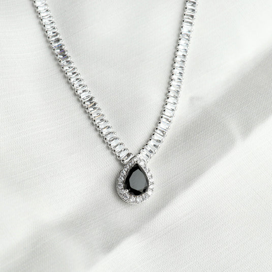 Elegant silver chain with a teardrop black gemstone pendant for midnight eclipse necklace