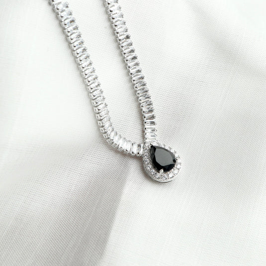 Silver chain with a teardrop black stone pendant featuring clear crystals midnight eclipse necklace