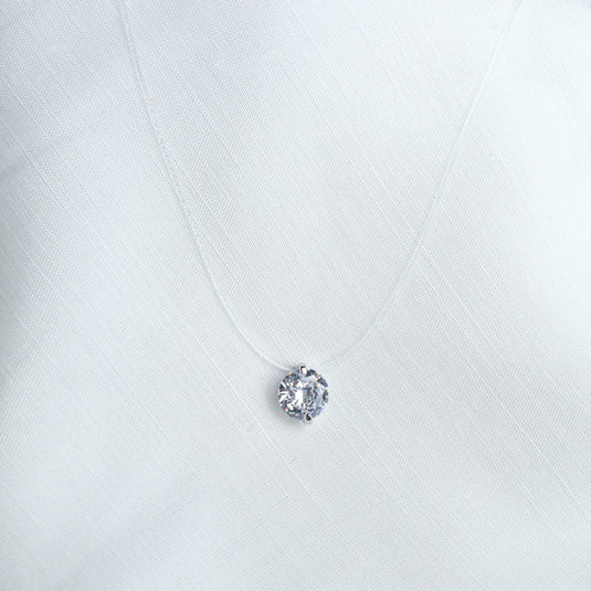 QuinShine minimalist jewelry necklace featuring a single round clear gemstone pendant on a delicate chain
