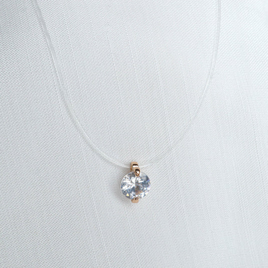 QuinShine minimalist jewelry necklace featuring a clear round pendant on a delicate chain