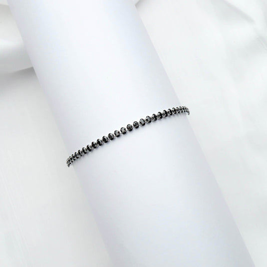 Minimalist silver Chain bracelet with Black Stone by QuinShine displayed on white background