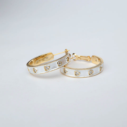 QuinShine Moonlit Dazzle Hoops gold hoop earrings with white enamel and heart-shaped crystals
