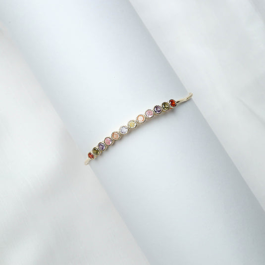 QuinShine delicate multi-stone bracelet for women featuring colorful gemstones set in a gold band
