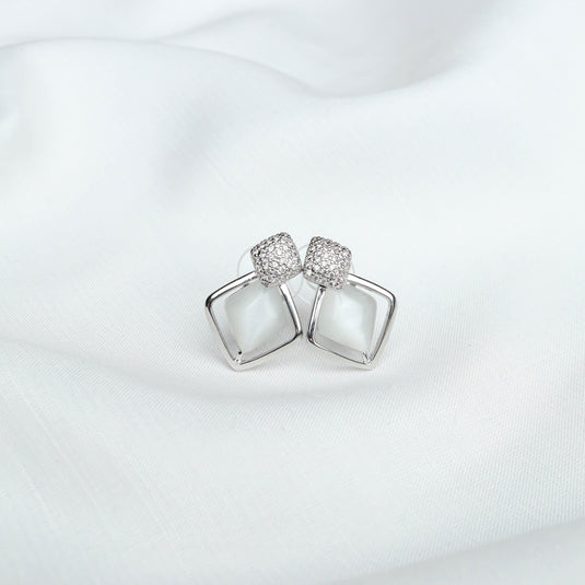 QuinShine elegant Opal gemstone earrings with square design and sparkling accents on white fabric