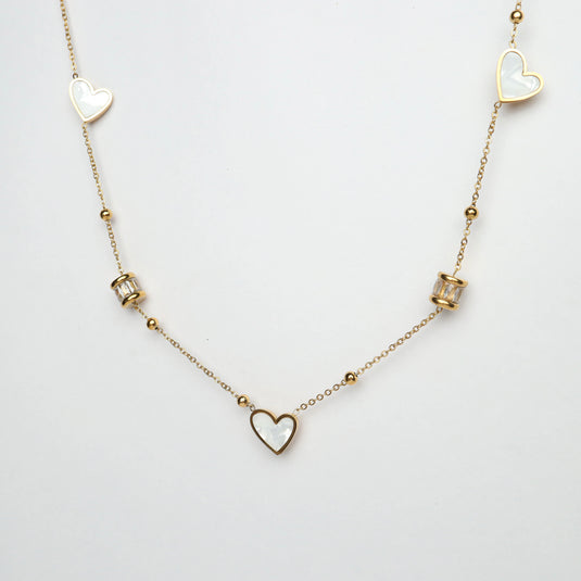 Delicate pearl heart chain necklace with gold links and heart-shaped pearl accents from QuinShine