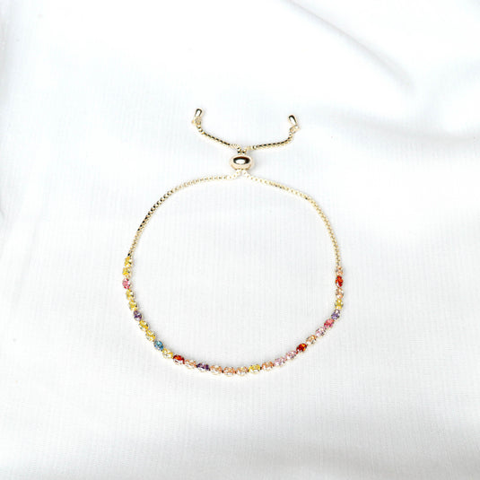 QuinShine delicate gold chain rainbow tennis bracelet with multicolored gemstones on white background