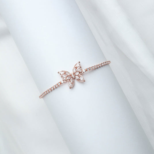 QuinShine delicate rose gold butterfly bracelet with sparkling stones on a white background