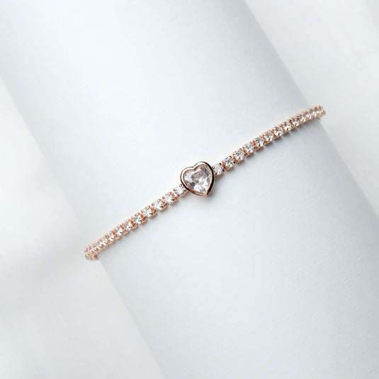 QuinShine delicate rose gold heart bracelet with sparkling stones on a white background