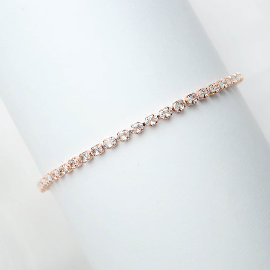 QuinShine delicate rose gold line bracelet with sparkling round crystals on white background