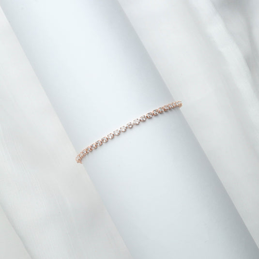 QuinShine delicate rose gold line bracelet with sparkling stones on white background