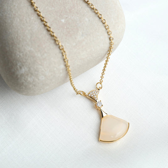 Elegant rose quartz pendant jewelry with gold chain and diamond accents from QuinShine
