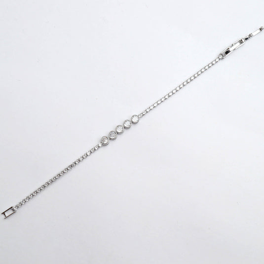 QuinShine bezel set tennis bracelet with sparkling round stones in silver setting