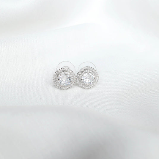 QuinShine silver halo earrings with round center stones and sparkling crystal accents on white background
