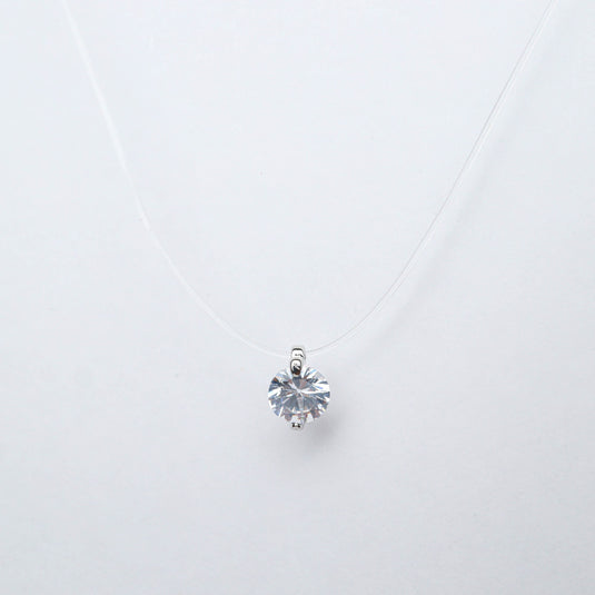 QuinShine solitaire transparent necklace with a single round clear gemstone pendant on a thin clear string