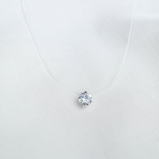 QuinShine solitaire transparent necklace with a single sparkling round crystal pendant on clear cord
