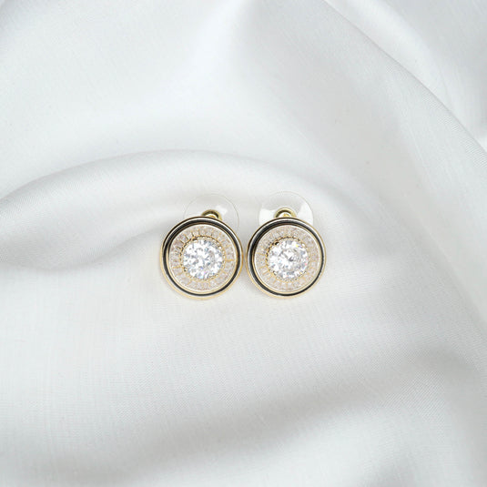 QuinShine stud earrings with sparkling stones featuring a unique cosmic earrings design on white fabric