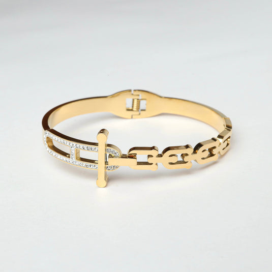 QuinShine golden equinox bracelet with a chain link design and sparkling accents on a white background