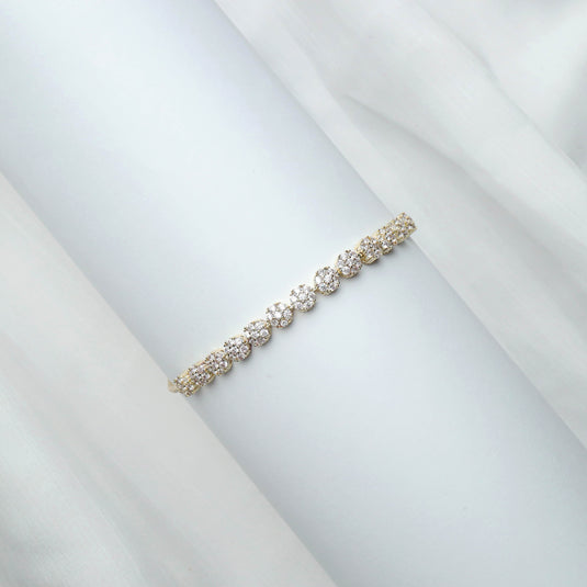 QuinShine luxury gold bracelet with sparkling round gemstones on elegant display