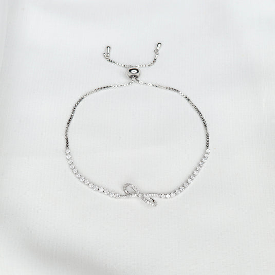 Minimalist Infinite Bow bracelet with silver chain and sparkling stones from QuinShine Online Jewellery Store