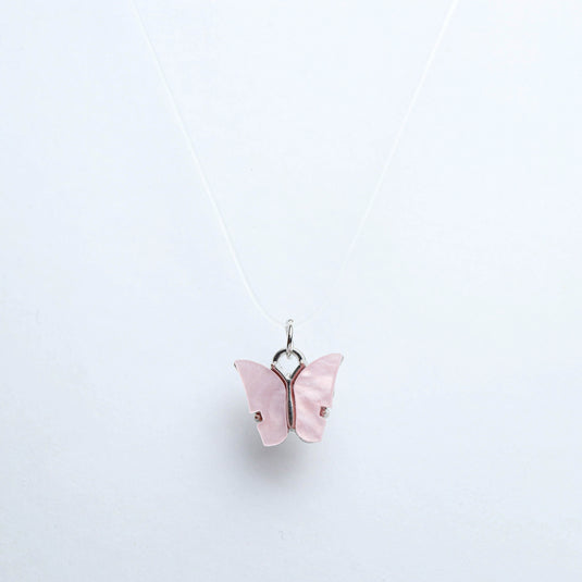 QuinShine pastel butterfly necklace with delicate pink butterfly pendant on a thin silver chain