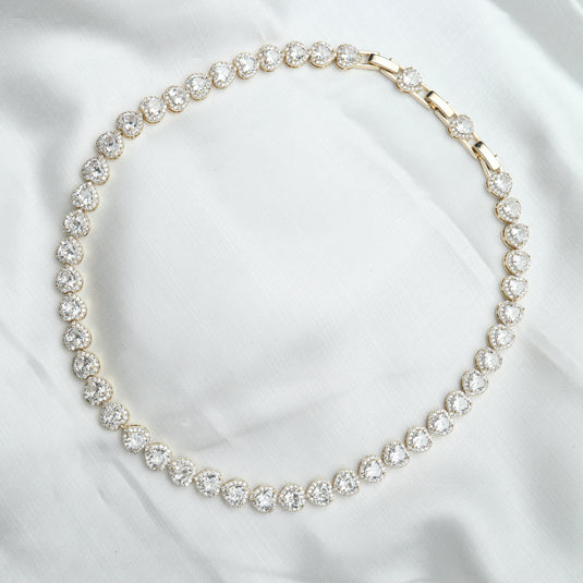 QuinShine white gemstone heart necklace featuring sparkling heart-shaped white gemstones on a delicate chain