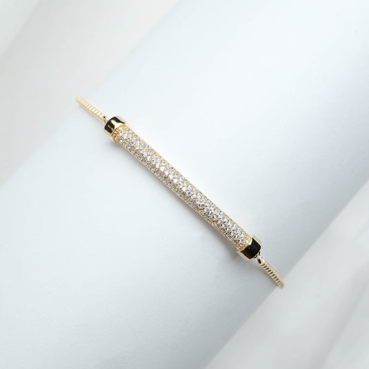 QuinShine women's luxury bracelet with gold finish and sparkling pave stones on a delicate band